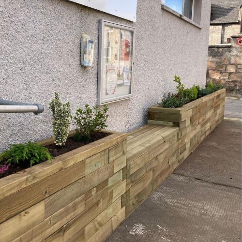Raised planter with bench for a yoga studio