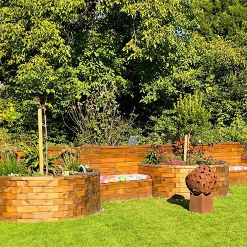 Eric’s garden wall with semi circular raised beds