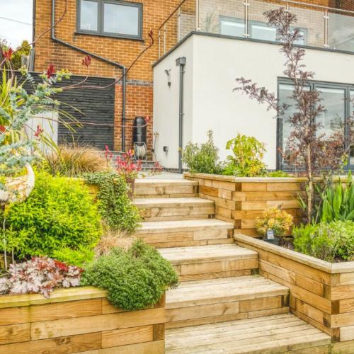 Luke's retaining wall with planters and steps