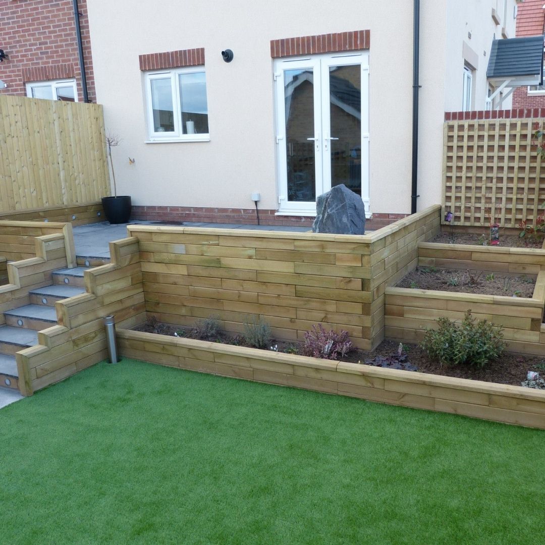 Multi-level new build garden design with steps and planters