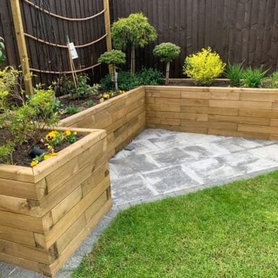 Raised corner bed with patio area Raised corner bed with patio area